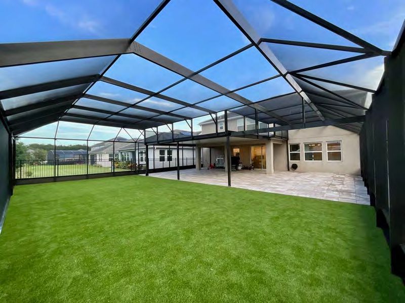 Completed artificial turf installation in Florida residential landscape