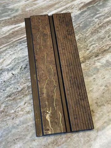 Decorative ceiling panels creating warm ambiance under pergola