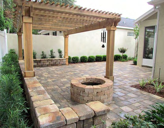 Rustic wood-burning fire pit with natural stone surround