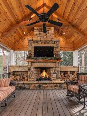 Large outdoor fireplace with stacked stone veneer construction