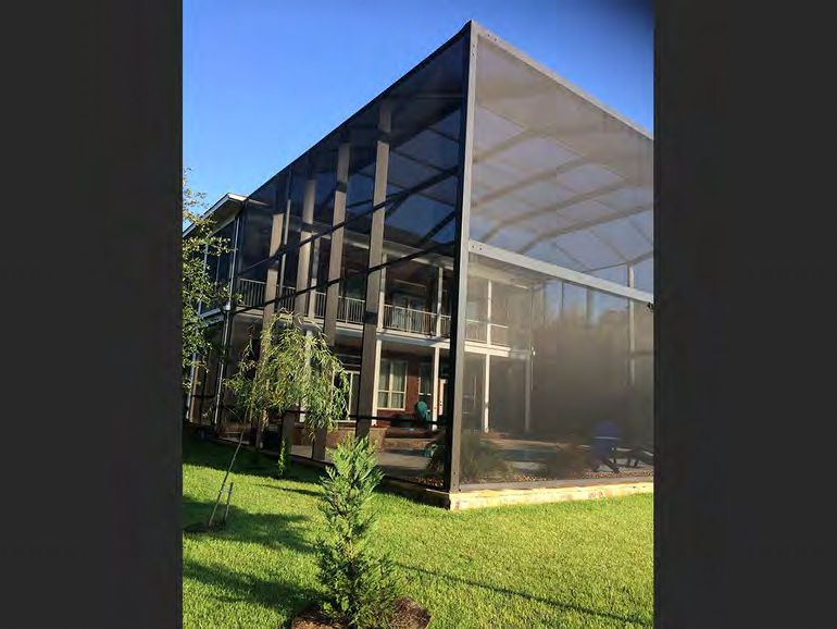 Open view patio enclosure creating seamless indoor-outdoor living