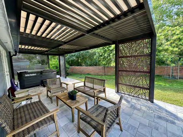 Outdoor kitchen with built-in lighting for evening entertainment