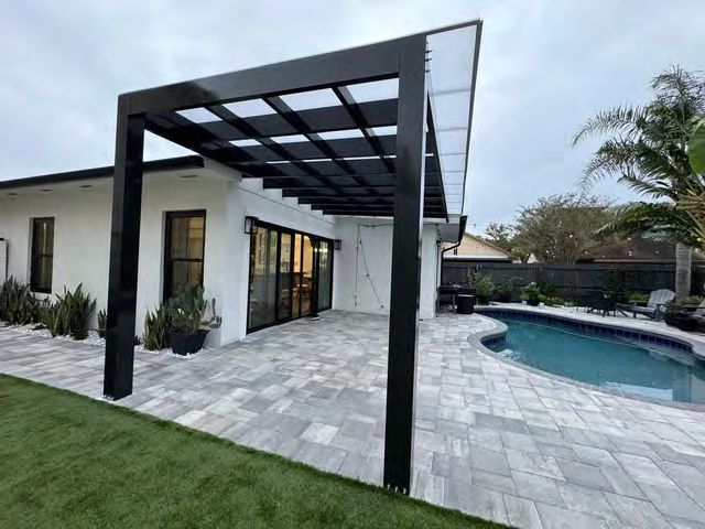 Pergola installed over pool deck area for poolside shade