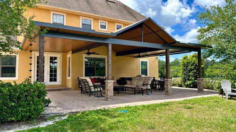 Pergola extending covered patio space for outdoor furniture