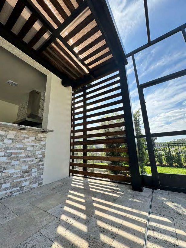 Modern horizontal privacy wall complementing pergola structure