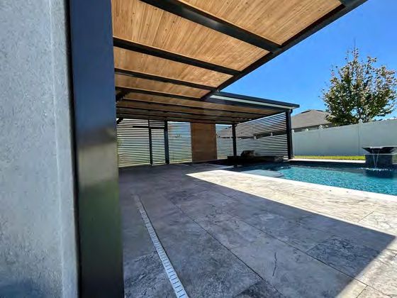 Side privacy wall on pergola for wind and neighbor screening