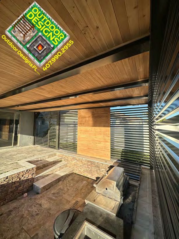 Privacy wall combining wood-look finish with metal durability