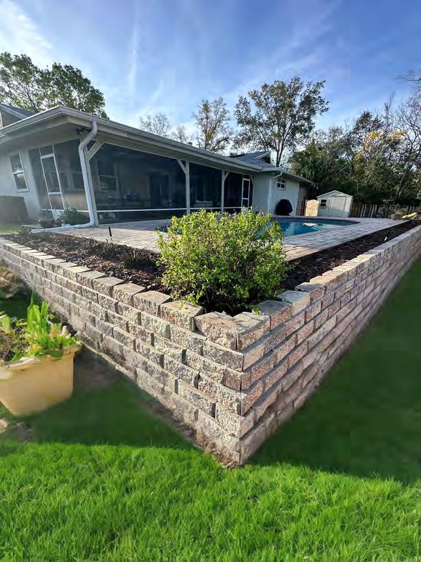 Brick retaining wall with tiered design for landscaping