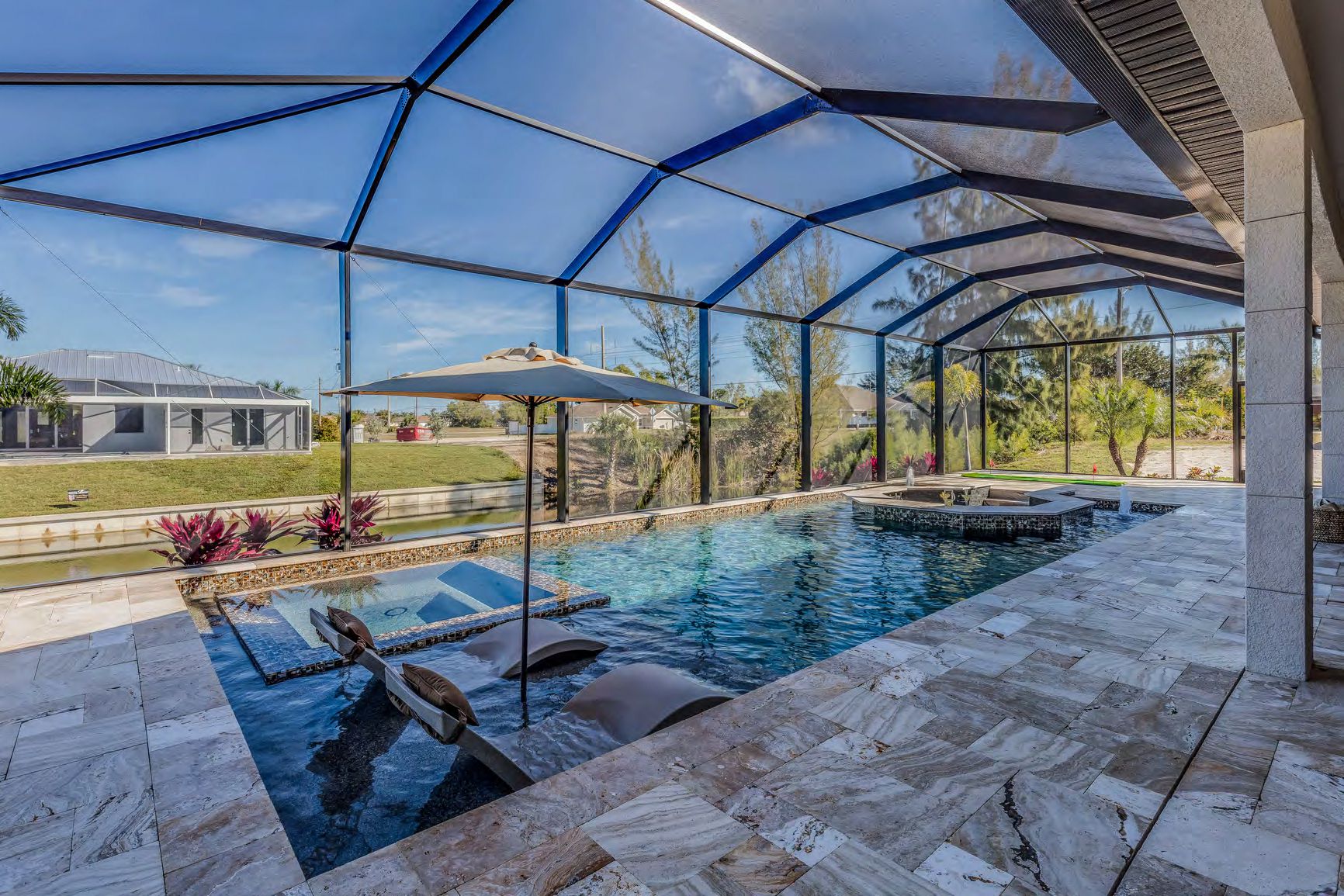 Completed screen enclosure project protecting full backyard area
