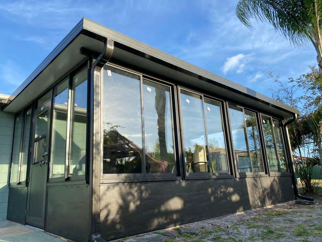 Hurricane-rated sunroom with impact aluminum windows and doors in Florida